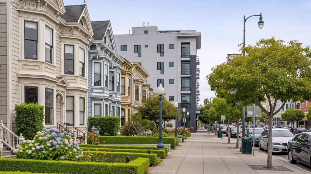 Victorian-style homes line a landscaped street in this ground-level view through central Alameda