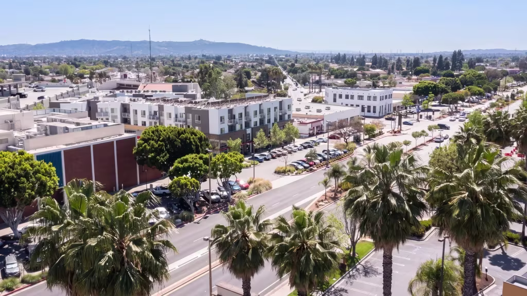 Baldwin Park's low-rise commercial corridor threads through surrounding neighborhoods in this aerial city view