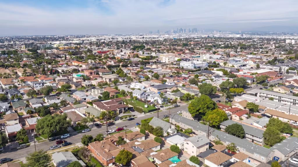 Bell's dense low-rise blocks and commercial streets fill this high aerial panoramic view