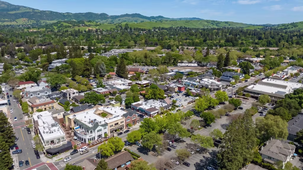 A tree-filled town center anchors Danville, with green hills rising on every side
