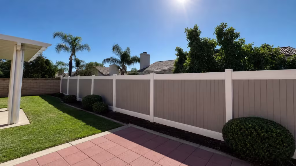 A cream patio cover overlooks this White two-tone vinyl fence, built for privacy, in Rancho Cucamonga