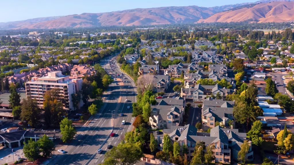 Broad suburban neighborhoods stretch across Fremont beneath a line of distant mountains
