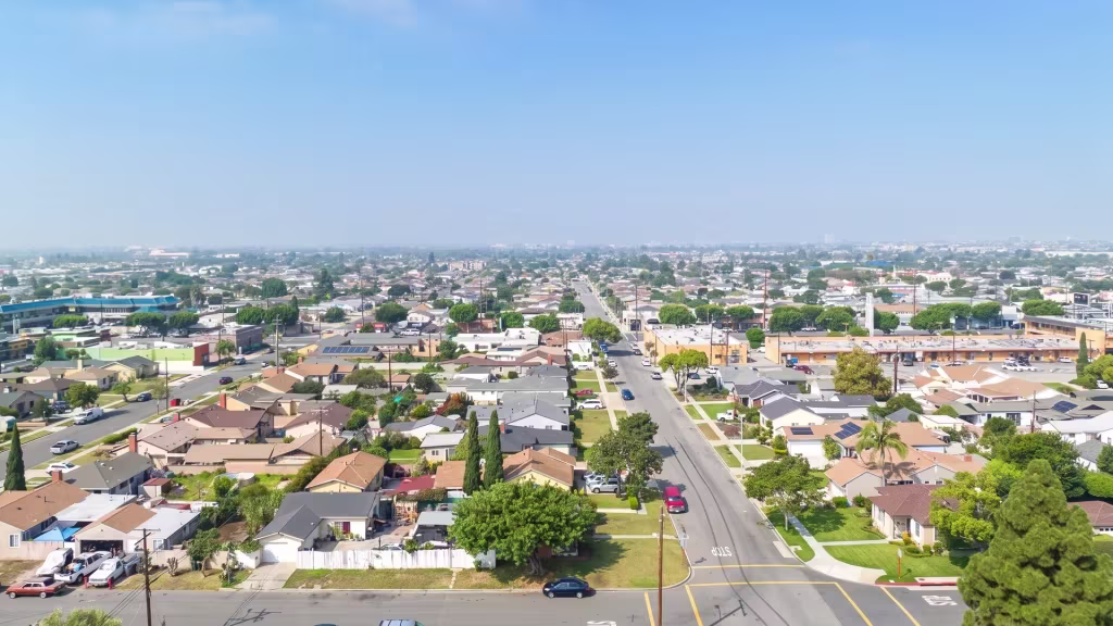 Gardena's low-rise residential and commercial grid spreads wide in this high aerial panoramic frame