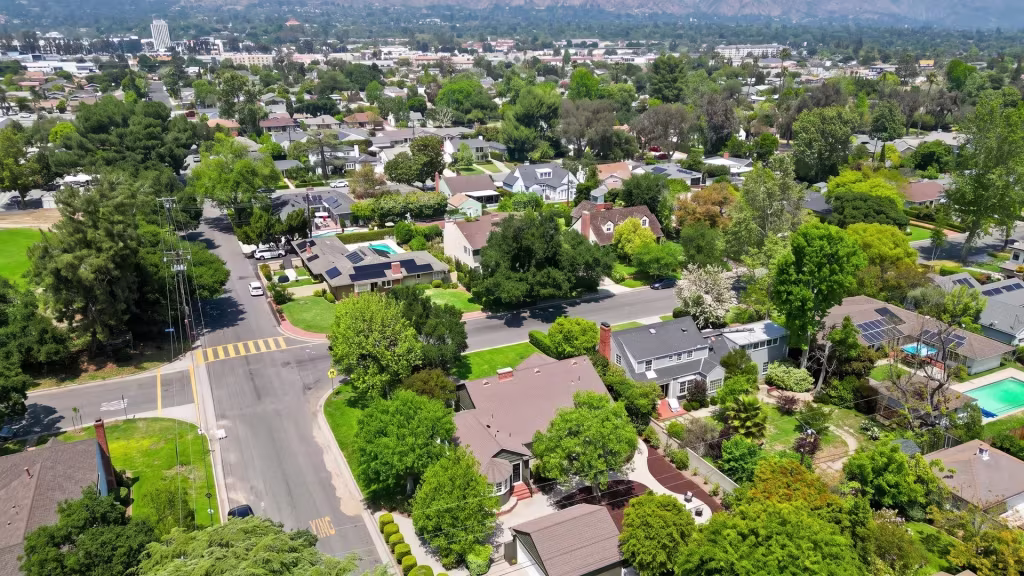 Glendora's tree-lined residential streets spread toward nearby foothills in this high aerial view