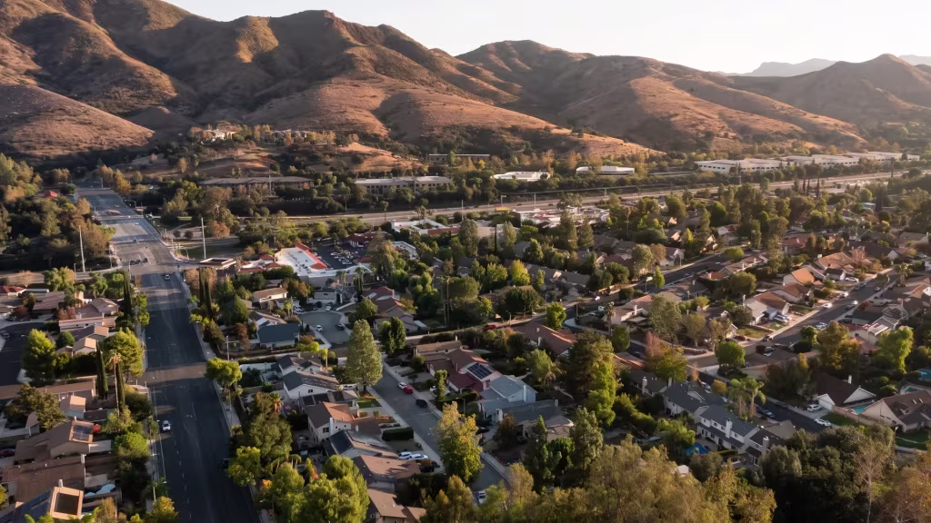 Granada Hills' suburban streets stretch along dry foothill slopes in this elevated panoramic frame