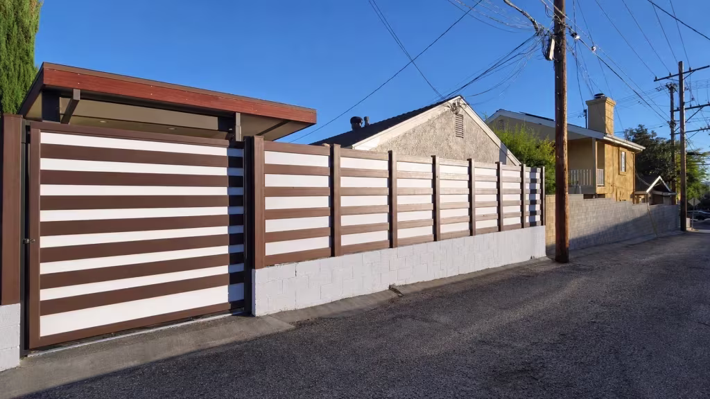 Dark Sequoia vinyl horizontal privacy-and-acrylic fence running past a Burbank garage roofline along the alley