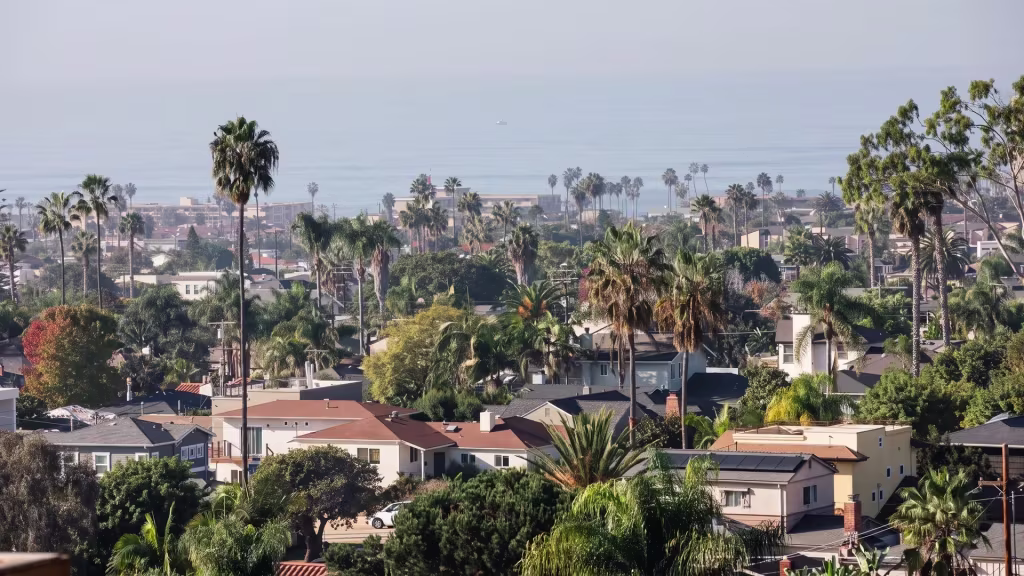 Palm-filled hillside neighborhoods overlook the valley in this elevated view over Mission Hills