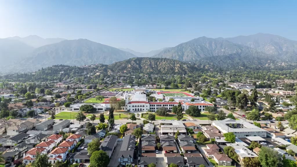 Monrovia's foothill city center and neighborhoods appear beneath the mountains in this elevated view