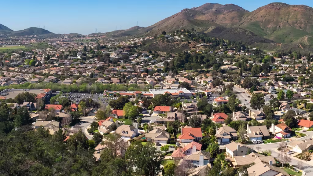 Elevated view over Newbury Park, hillside neighborhoods set amid a stretch of rugged hills