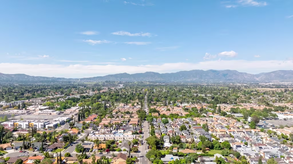A broad suburban stretch of North Hills appears in this aerial panorama, backed by distant foothills