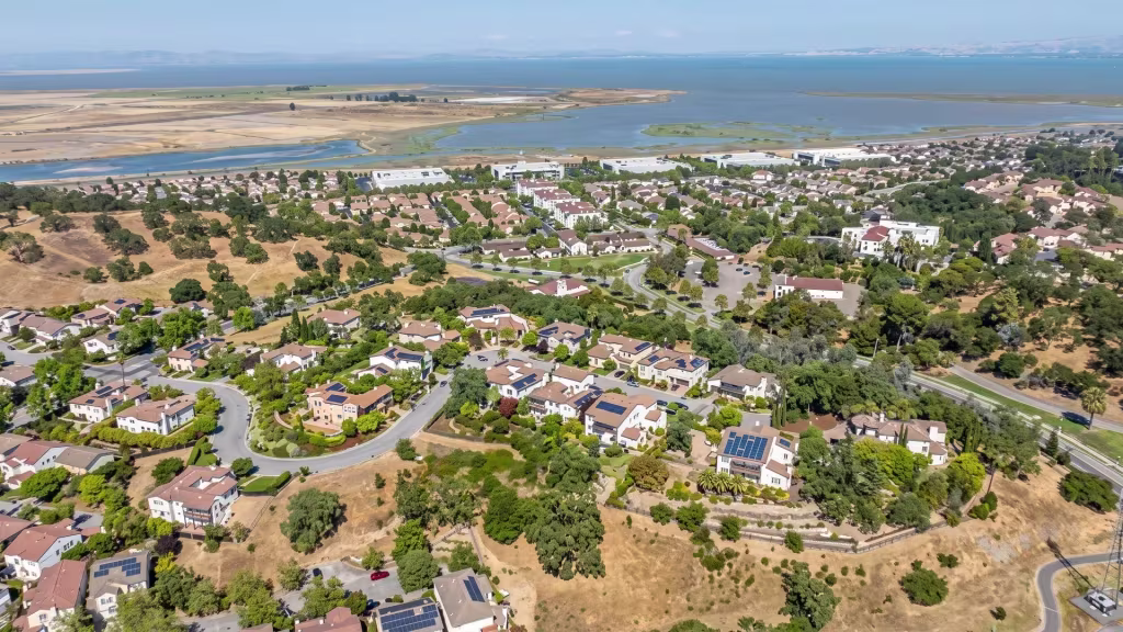 Residential neighborhoods in Novato reach toward wetlands that lead out to the bay