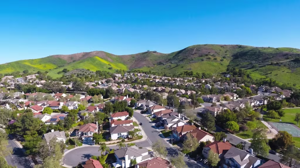 Oak Park's planned homes sit at the foot of green hills in this aerial neighborhood view