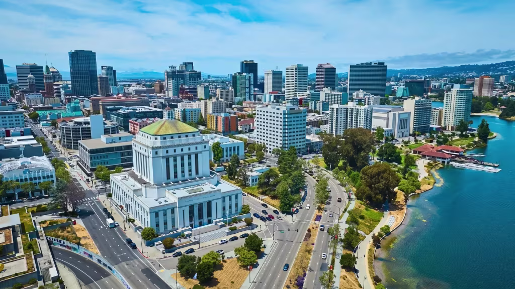 Oakland's downtown skyline, civic buildings, and a lake come together in this aerial view