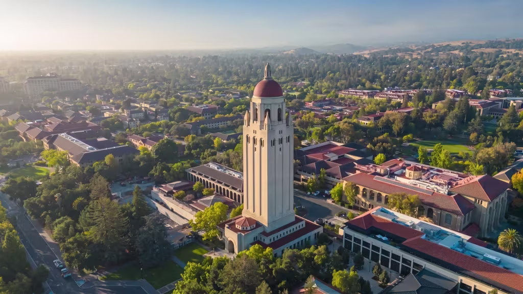 Palo Alto's university tower stands above landscaped campus grounds in this high aerial oblique view