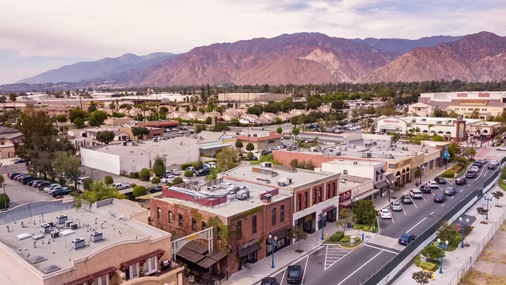 Panorama City's downtown commercial avenue runs beneath distant mountains in this aerial view