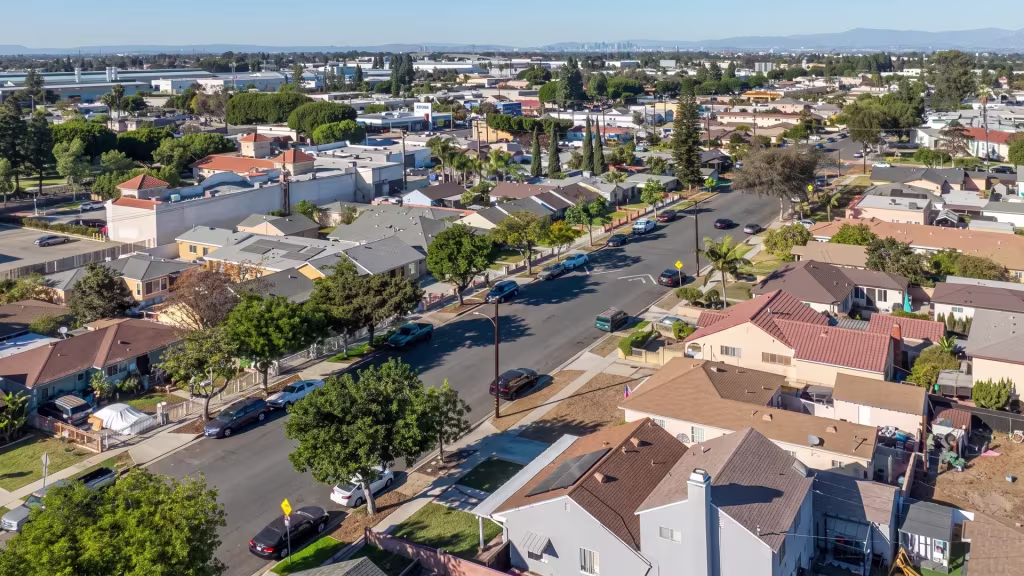 Paramount's low-rise neighborhoods stretch toward a broad horizon in this aerial panorama