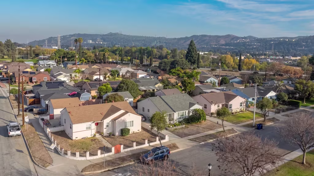 Pico Rivera's residential district spreads beneath a mountain backdrop in this elevated panorama
