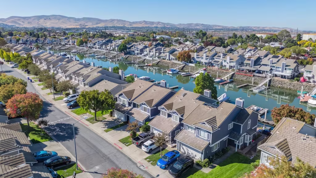 New waterfront homes and quiet local streets fill this aerial neighborhood view over Pittsburg