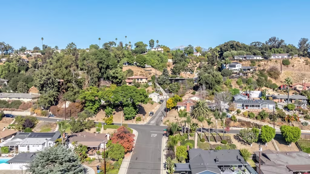 Pomona's hillside neighborhoods and tree-lined streets stretch across this aerial panorama into the distance
