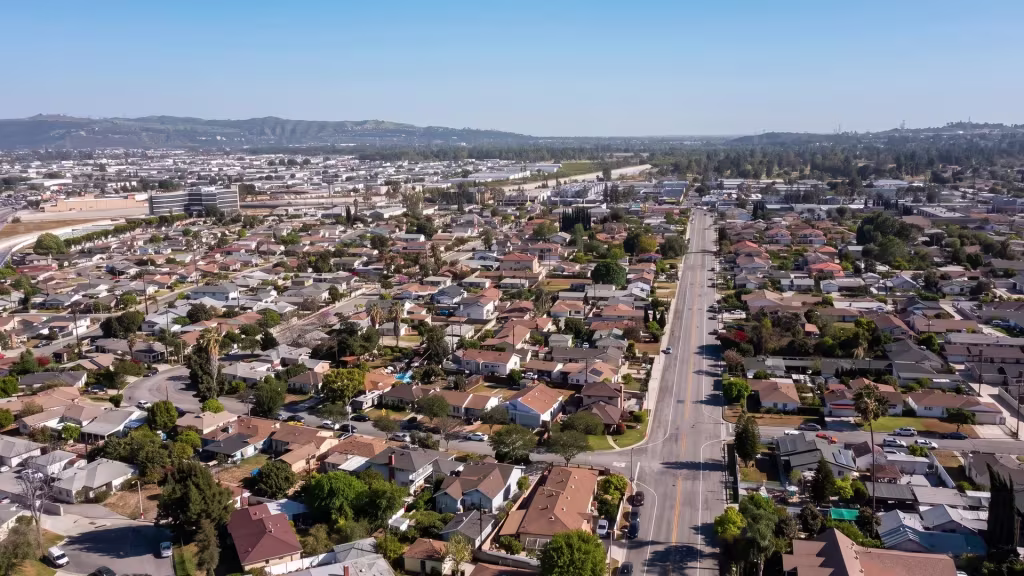A dense residential grid lines a long arterial road through Rosemead in this aerial view