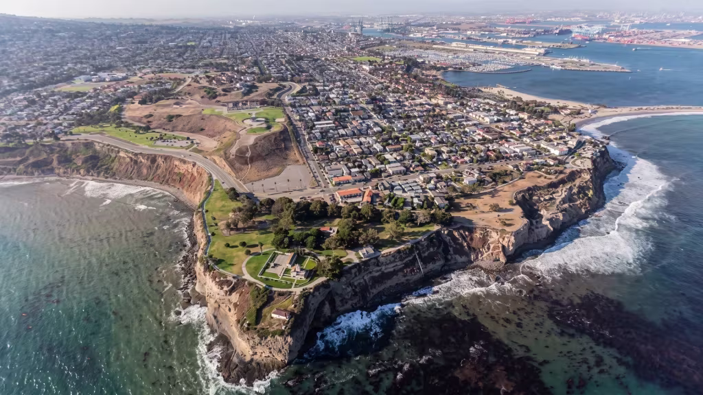 San Pedro's rugged coastline and coastal bluffs meet the city grid in this aerial view