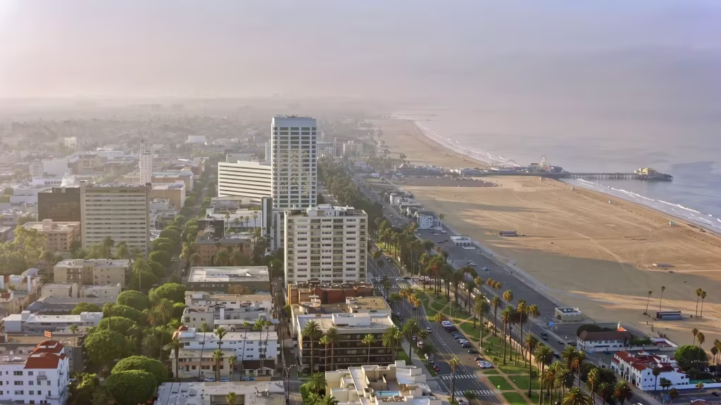 Santa Monica's coastline stretches beside the city and its beach in this panoramic view