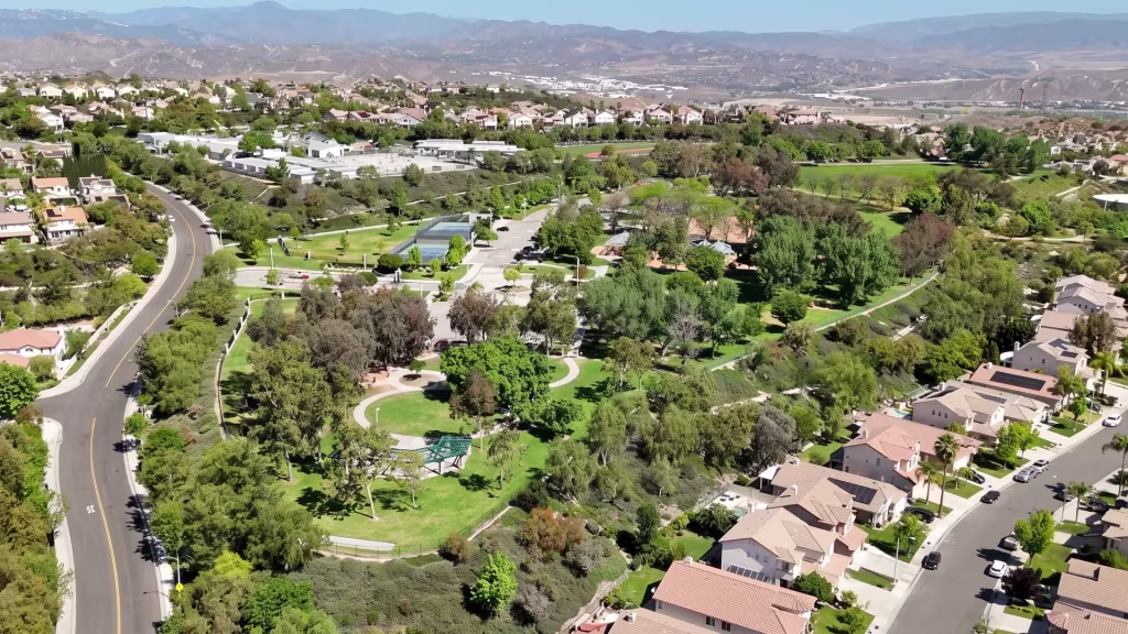 Aerial view over Stevenson Ranch, a planned hillside community laid out with winding roads and green space
