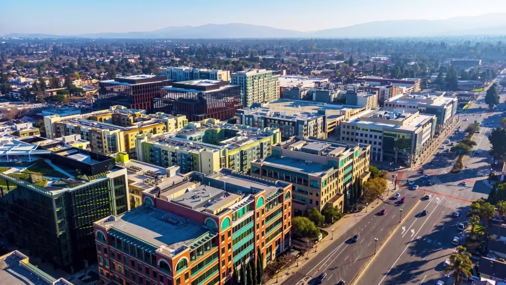 A modern mixed-use district lines a channel in this aerial city view over Sunnyvale