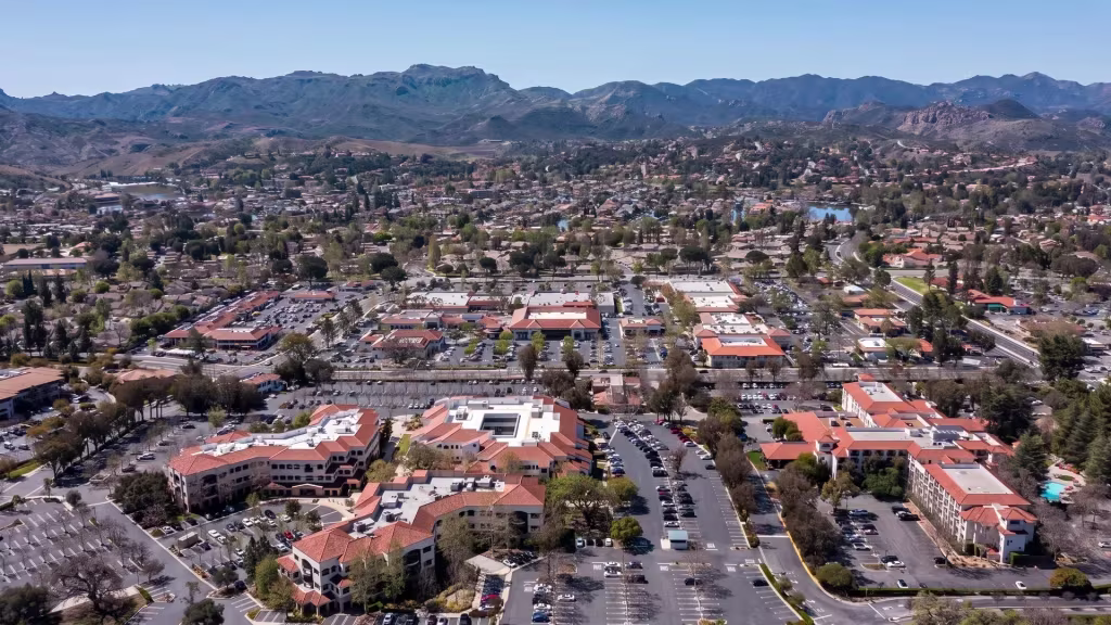 Aerial panorama over Thousand Oaks, a low-rise city spread across a series of gentle hills