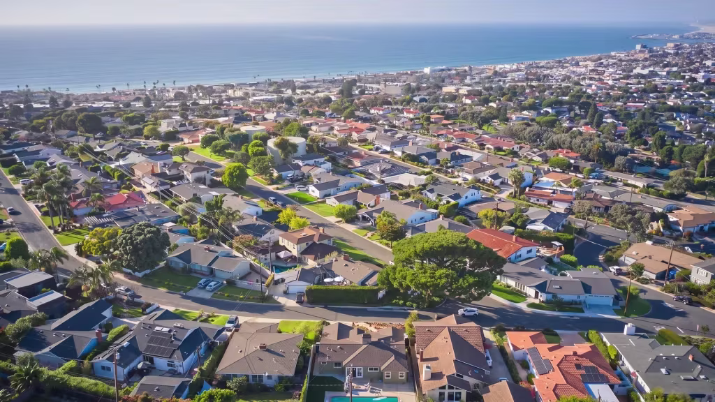 Torrance's suburban neighborhoods extend outward toward the coast in this high aerial view