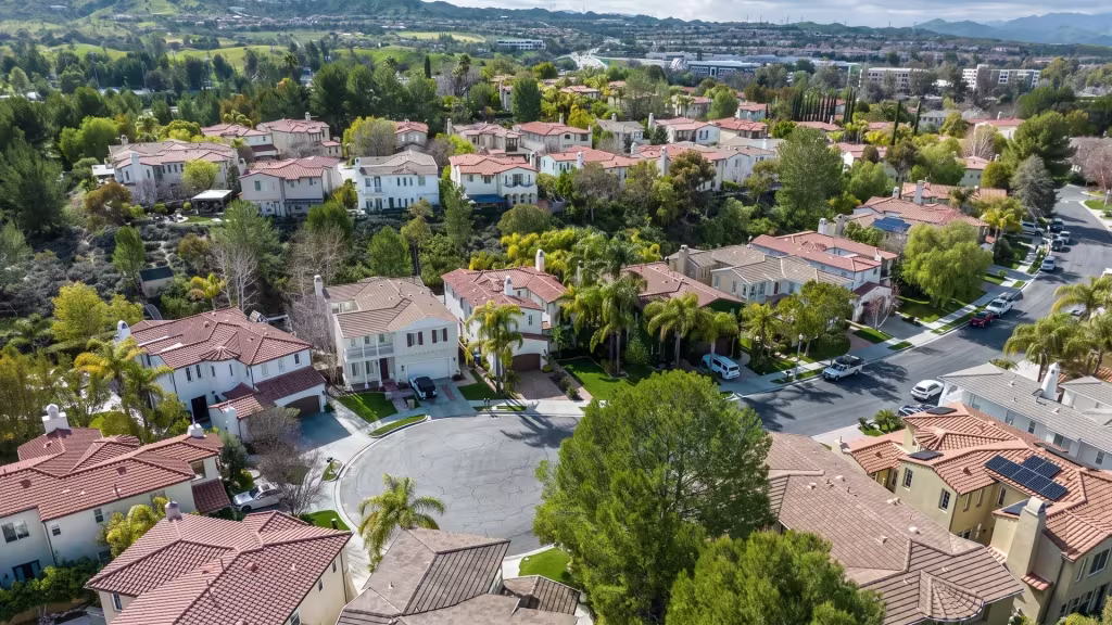Aerial view over Valencia, a planned residential neighborhood surrounded by green hills