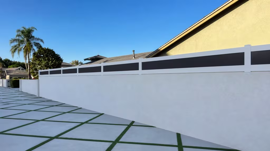 Dark acrylic infill bays top a White custom vinyl wall topper above a concrete paving grid with dark joints