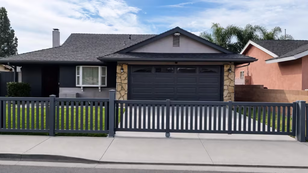 Arctic Blend vinyl rolling gate set into a close-top vertical picket fence across six posts and five bays