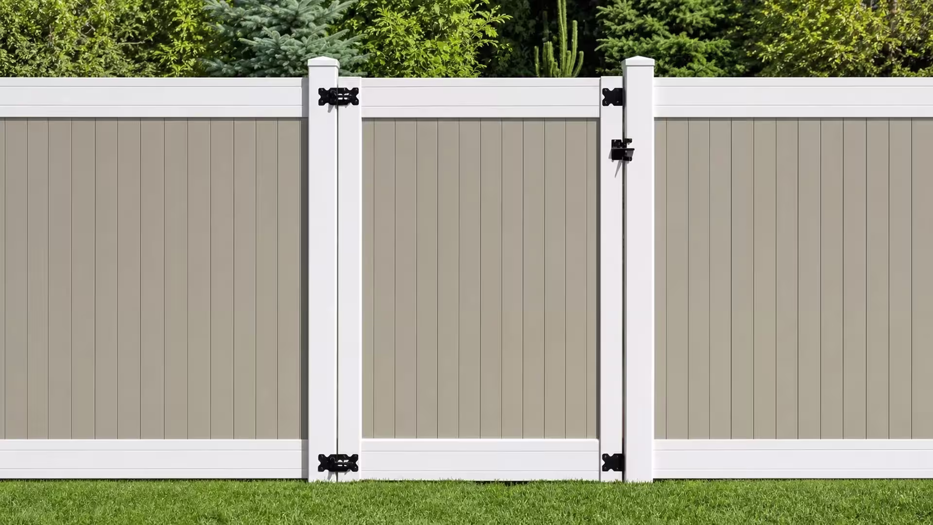 A tall cactus and dense trees rise behind this Tan vinyl side gate near the fence line