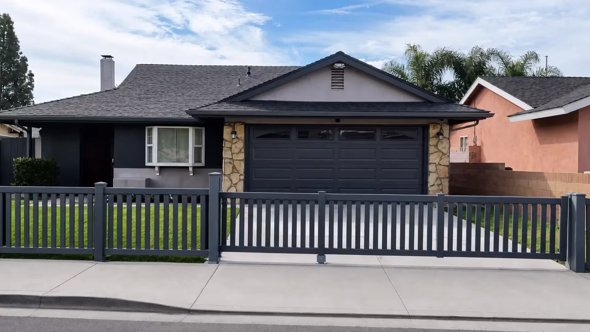 Arctic Blend vinyl picket fence, closed at the top, spans a front yard in one run with no gate break