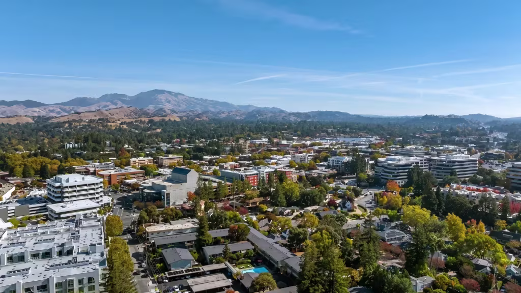 Hills surround a green urban center in this elevated panoramic view over Walnut Creek