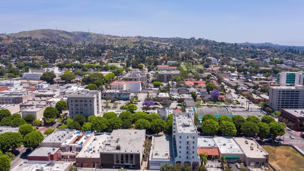 Whittier's downtown district sits low among the hills that surround it, viewed from an elevated oblique angle