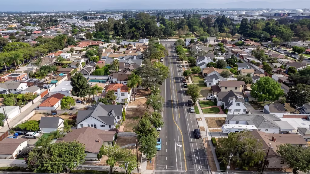 A long arterial road runs through Wilmington's mixed residential and industrial grid, seen from above