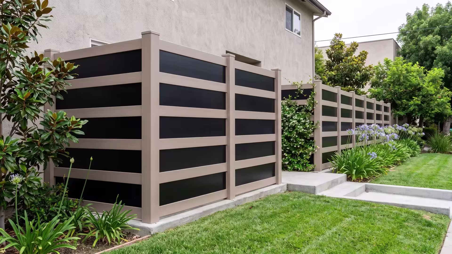 Clay vinyl privacy fence with acrylic closing a courtyard side yard past poured concrete retaining steps