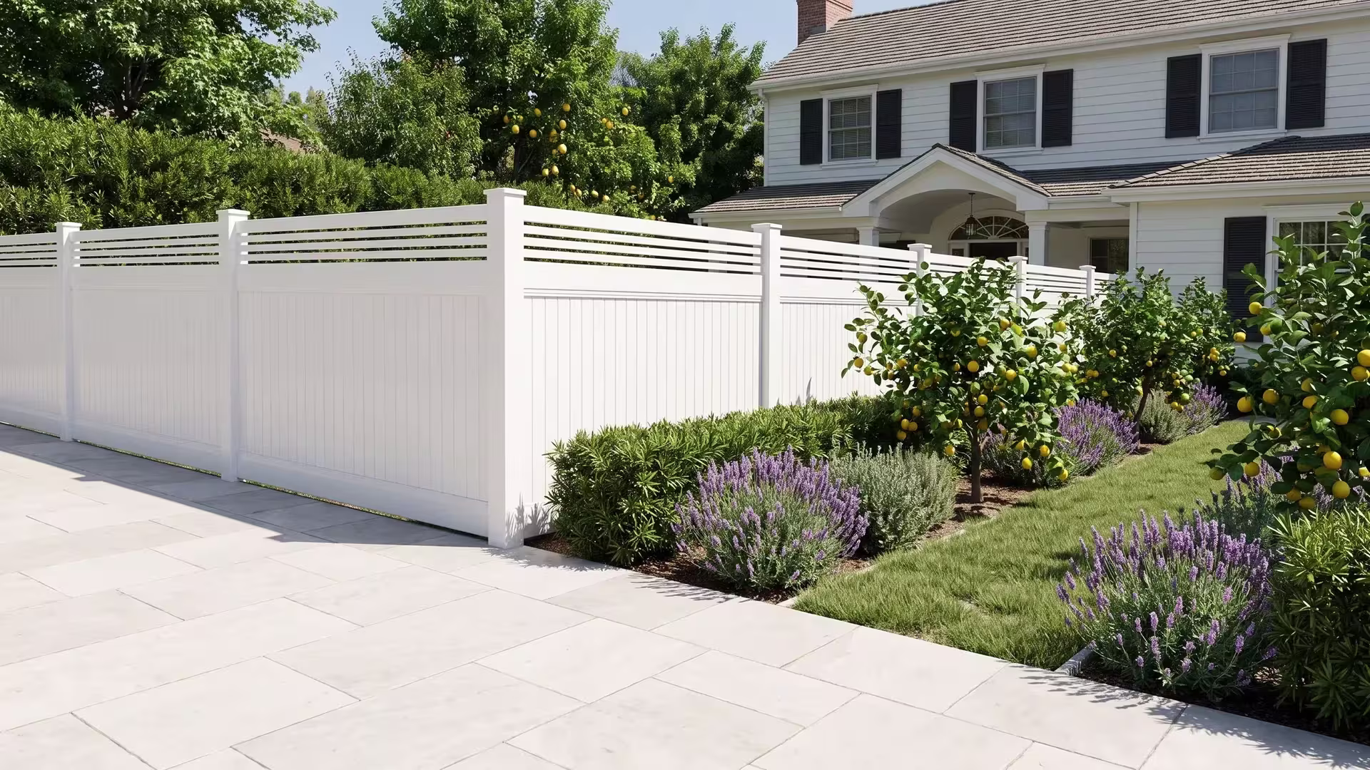 White vinyl vertical privacy fence with a horizontal picket top enclosing a front yard beside a two-story home