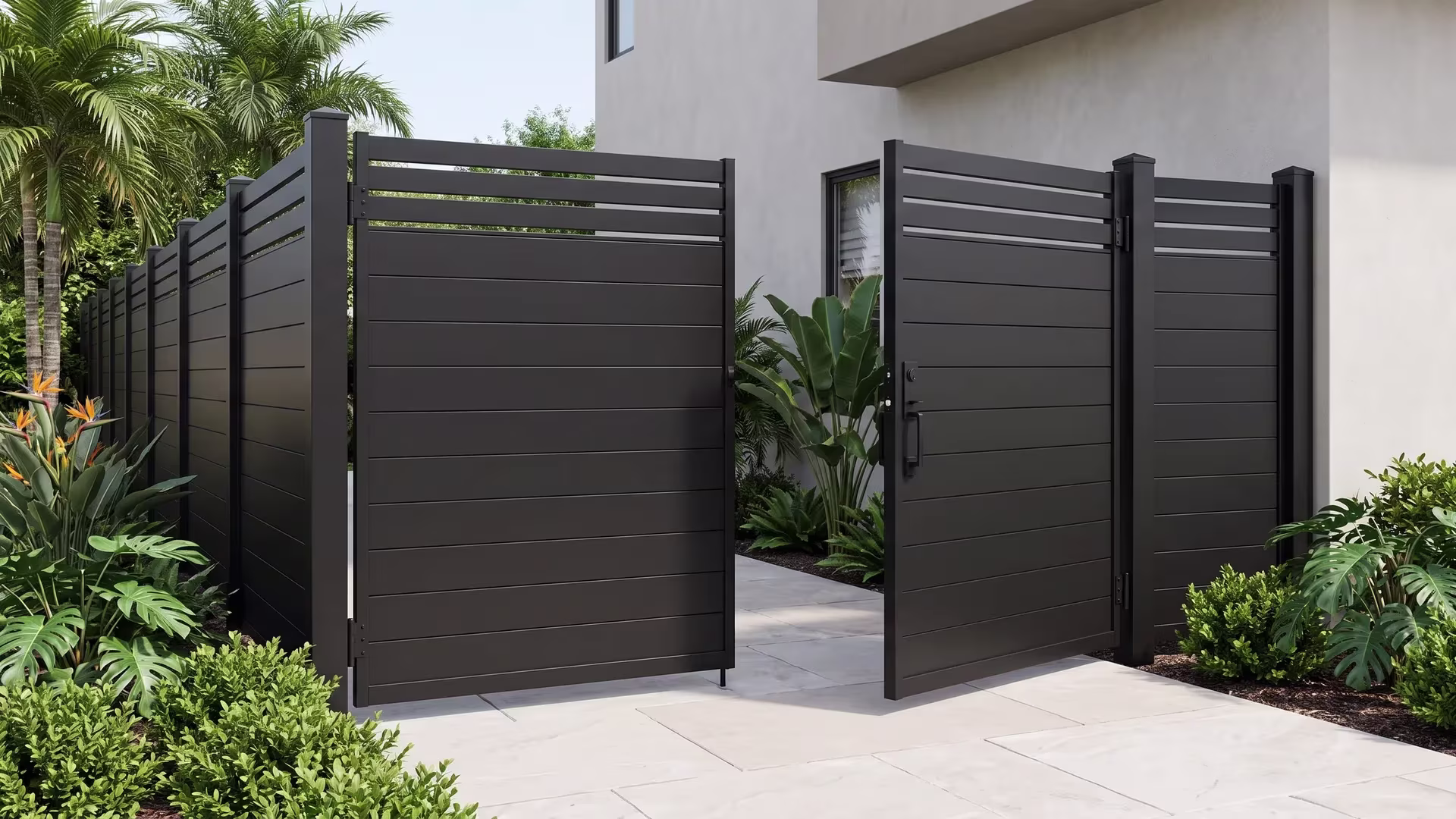 Black privacy hybrid aluminum double opening gate framed by a smooth stucco facade on an urban driveway